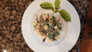 Goat cheese pasta with mixed greens.